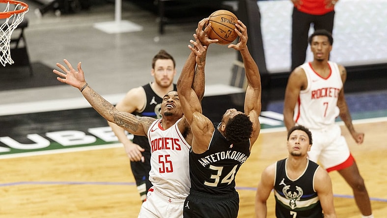 May 7, 2021; Milwaukee, Wisconsin, USA; Houston Rockets guard DaQuan Jeffries (55) and Milwaukee Bucks forward Giannis Antetokounmpo (34) reach for a rebound during the first quarter at Fiserv Forum. Mandatory Credit: Jeff Hanisch-USA TODAY Sports