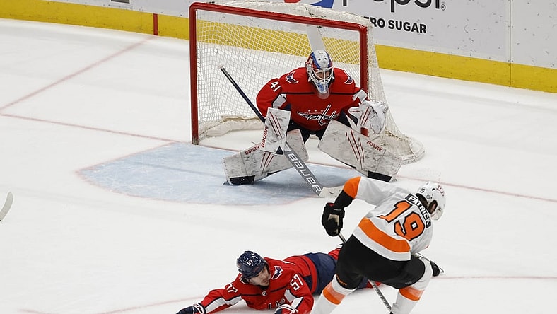 May 7, 2021; Washington, District of Columbia, USA; Washington Capitals defenseman Trevor van Riemsdyk (57) blocks a shot by Philadelphia Flyers center Nolan Patrick (19) in front of Capitals goaltender Vitek Vanecek (41) in the third period at Capital One Arena. Mandatory Credit: Geoff Burke-USA TODAY Sports