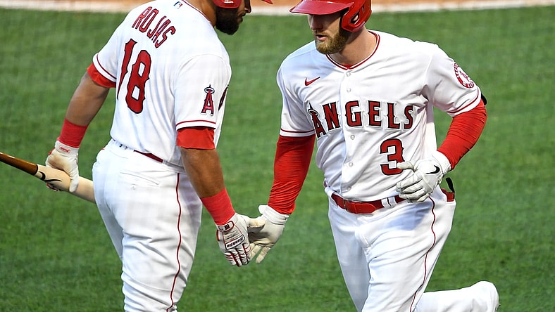 May 7, 2021; Anaheim, California, USA; Los Angeles Angels right fielder Taylor Ward (3) is greeted by third baseman Jose Rojas (18) after hitting a solo home run during the second inning against the Los Angeles Dodgers at Angel Stadium. Mandatory Credit: Jayne Kamin-Oncea-USA TODAY Sports