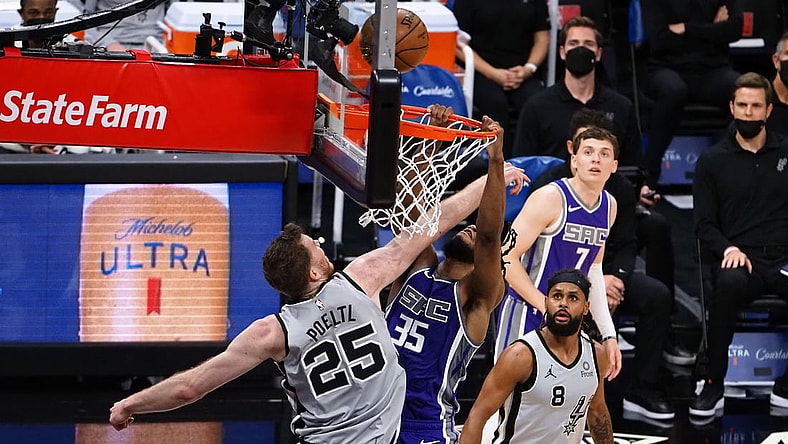 May 7, 2021; Sacramento, California, USA; San Antonio Spurs center Jakob Poeltl (25) reaches in against Sacramento Kings forward Marvin Bagley III (35) during the second quarter at Golden 1 Center. Mandatory Credit: Kelley L Cox-USA TODAY Sports