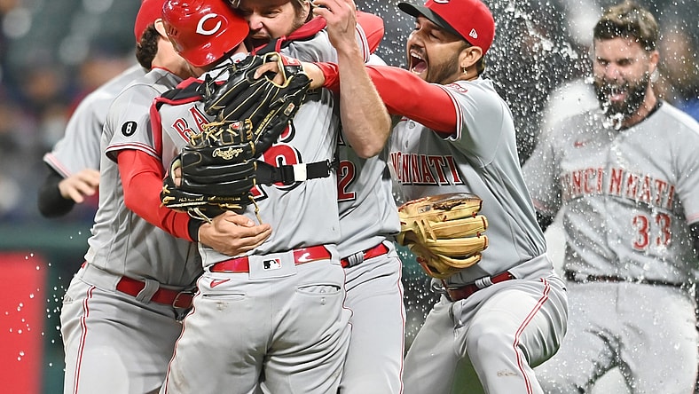 May 7, 2021; Cleveland, Ohio, USA; Cincinnati Reds starting pitcher Wade Miley (22) and catcher Tucker Barnhart (16) and third baseman Eugenio Suarez (7) celebrate after Miley threw a no-hitter against the Cleveland Indians at Progressive Field. Mandatory Credit: Ken Blaze-USA TODAY Sports