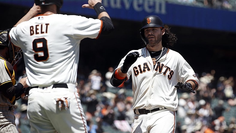 May 8, 2021; San Francisco, California, USA; San Francisco Giants shortstop Brandon Crawford (35) celebrates with first baseman Brandon Belt (9) after hitting a home run during the second inning against the San Diego Padres at Oracle Park. Mandatory Credit: Darren Yamashita-USA TODAY Sports