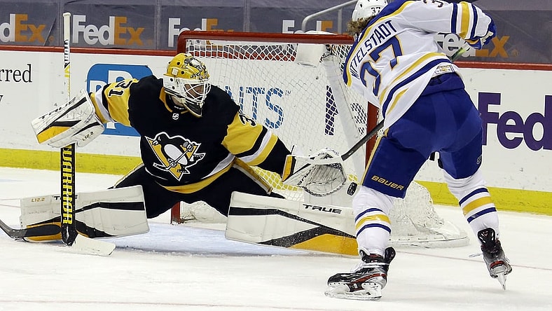 May 8, 2021; Pittsburgh, Pennsylvania, USA;  Pittsburgh Penguins goaltender Maxime Lagace (31) defends a shot by Buffalo Sabres center Casey Mittelstadt (37) during the second period at PPG Paints Arena. Mandatory Credit: Charles LeClaire-USA TODAY Sports