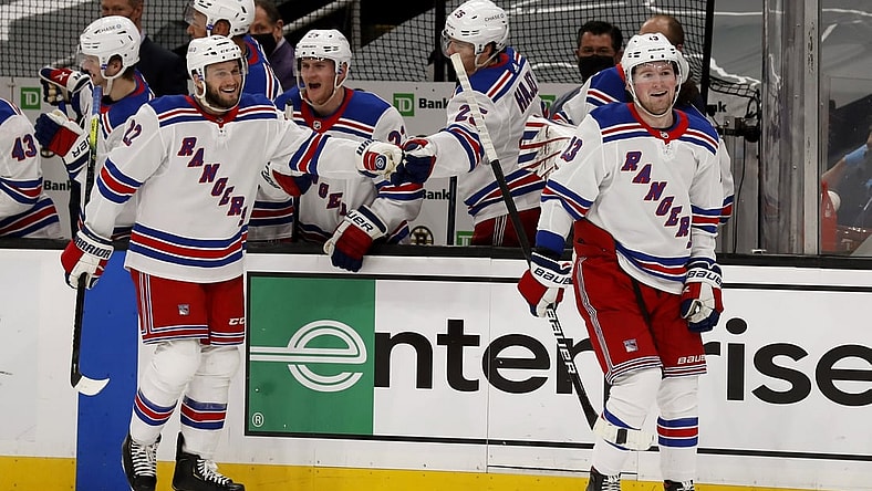 May 8, 2021; Boston, Massachusetts, USA; New York Rangers left wing Alexis Lafreni re (13) smiles after being congratulated at the bench after scoring with defenseman Anthony Bitetto (22) during the third period of their 5-4 win over the Boston Bruins at TD Garden. Mandatory Credit: Winslow Townson-USA TODAY Sports