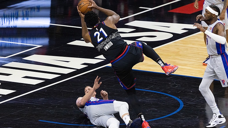 May 8, 2021; Philadelphia, Pennsylvania, USA; Philadelphia 76ers center Joel Embiid (21) collides and fouls Detroit Pistons center Mason Plumlee (24) while driving for a shot during the first quarter at Wells Fargo Center. Mandatory Credit: Bill Streicher-USA TODAY Sports
