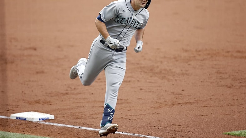 May 8, 2021; Arlington, Texas, USA; Seattle Mariners first baseman Evan White (12) rounds the bases after hitting a two run home run in the second inning against the Texas Rangers at Globe Life Field. Mandatory Credit: Tim Heitman-USA TODAY Sports
