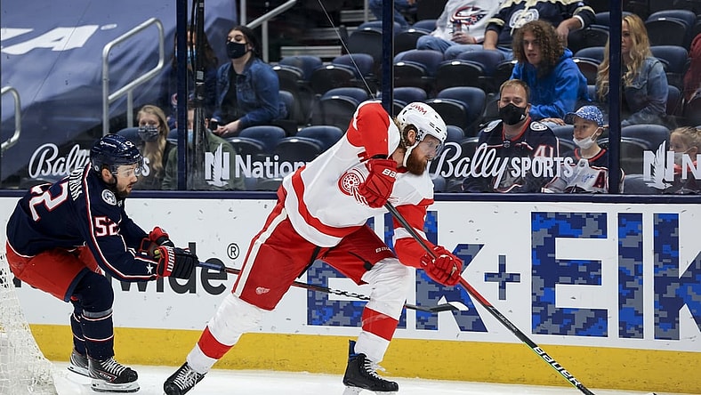 May 8, 2021; Columbus, Ohio, USA; Detroit Red Wings defenseman Marc Staal (18) controls the puck against Columbus Blue Jackets center Emil Bemstrom (52) in the 1st period at Nationwide Arena. Mandatory Credit: Aaron Doster-USA TODAY Sports