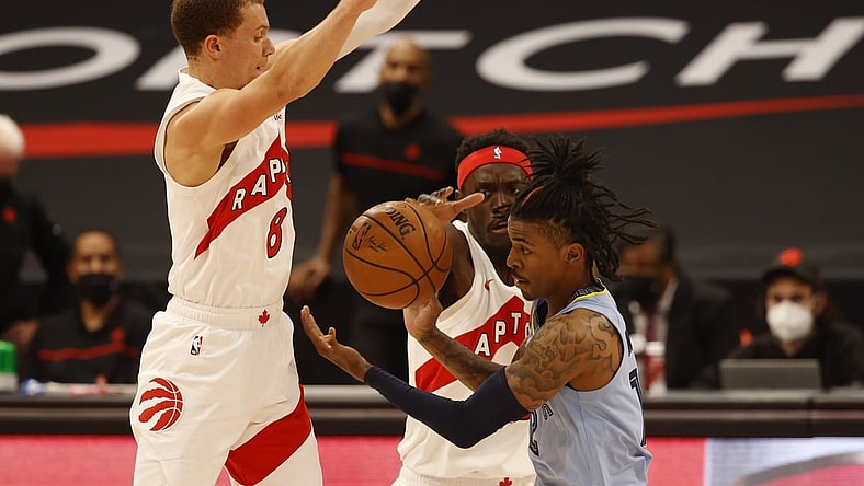 May 8, 2021; Tampa, Florida, USA;  Toronto Raptors forward Pascal Siakam (43) and Toronto Raptors guard Malachi Flynn (8) cause Memphis Grizzlies guard Ja Morant (12) to turn the ball over during the first half at Amalie Arena. Mandatory Credit: Kim Klement-USA TODAY Sports