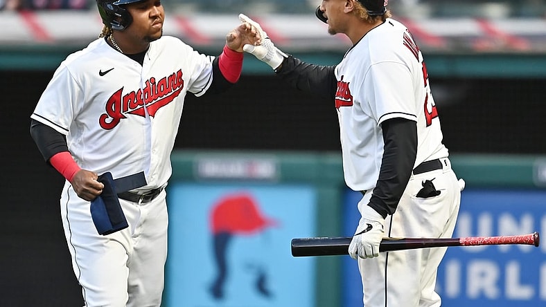 May 8, 2021; Cleveland, Ohio, USA; Cleveland Indians third baseman Jose Ramirez (left) celebrates with right fielder Josh Naylor (22) after scoring against the Cincinnati Reds during the sixth inning at Progressive Field. Mandatory Credit: Ken Blaze-USA TODAY Sports