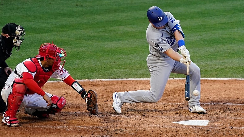 May 8, 2021; Anaheim, California, USA; Los Angeles Dodgers designated hitter Will Smith (16) hits a two run RBI single in the fourth inning against the Los Angeles Angels at Angel Stadium. Mandatory Credit: Robert Hanashiro-USA TODAY Sports