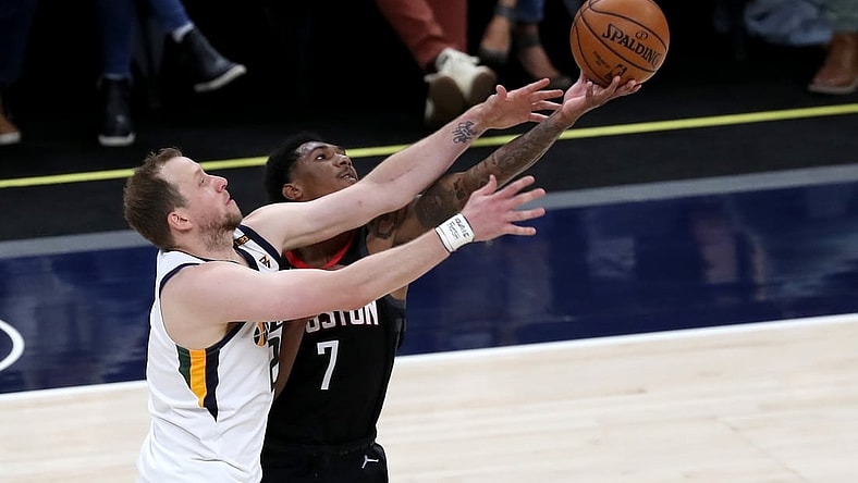 May 8, 2021; Salt Lake City, Utah, USA; Utah Jazz guard Joe Ingles (left) and Houston Rockets guard Armoni Brooks (7) battle for a loose ball in the second quarter at Vivint Arena. Mandatory Credit: Rob Gray-USA TODAY Sports