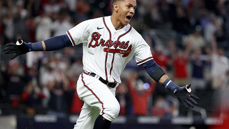 May 8, 2021; Atlanta, Georgia, USA; Atlanta Braves outfielder Ehire Adrianza (23) reacts after hitting the game winning RBI single during the twelfth inning against the Philadelphia Phillies at Truist Park. Mandatory Credit: Jason Getz-USA TODAY Sports