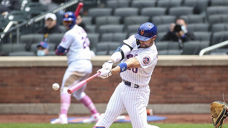 May 9, 2021; New York City, New York, USA;  New York Mets right fielder Michael Conforto (30) hits an RBI single in the third inning against the Arizona Diamondbacks at Citi Field. Mandatory Credit: Wendell Cruz-USA TODAY Sports