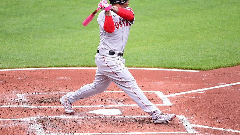 May 9, 2021; Baltimore, Maryland, USA; Boston Red Sox third baseman Rafael Devers (11) hits a home run during the second inning against the Baltimore Orioles at Oriole Park at Camden Yards. Mandatory Credit: Evan Habeeb-USA TODAY Sports
