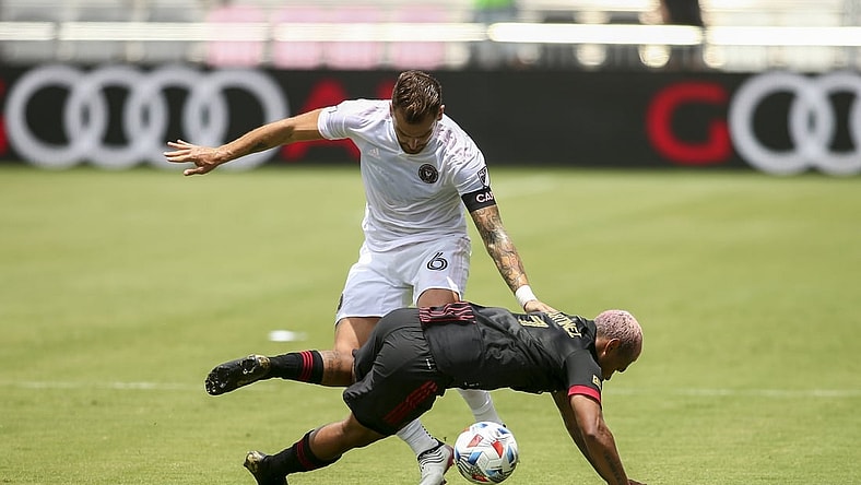 May 9, 2021; Fort Lauderdale, FL, Fort Lauderdale, FL, USA; Atlanta United forward Josef Martinez (7) gets fouled by Inter Miami CF defender Leandro Gonzalez (6) during the first half at DRV PNK Stadium. Mandatory Credit: Sam Navarro-USA TODAY Sports