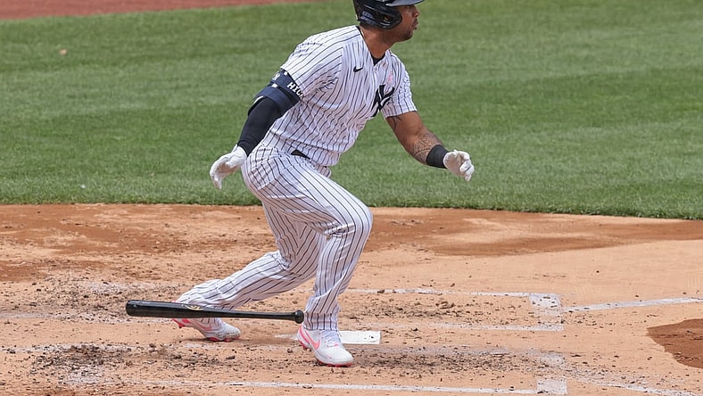 May 9, 2021; Bronx, New York, USA; New York Yankees center fielder Aaron Hicks (31) hits an RBI single during the third inning against the Washington Nationals at Yankee Stadium. Mandatory Credit: Vincent Carchietta-USA TODAY Sports