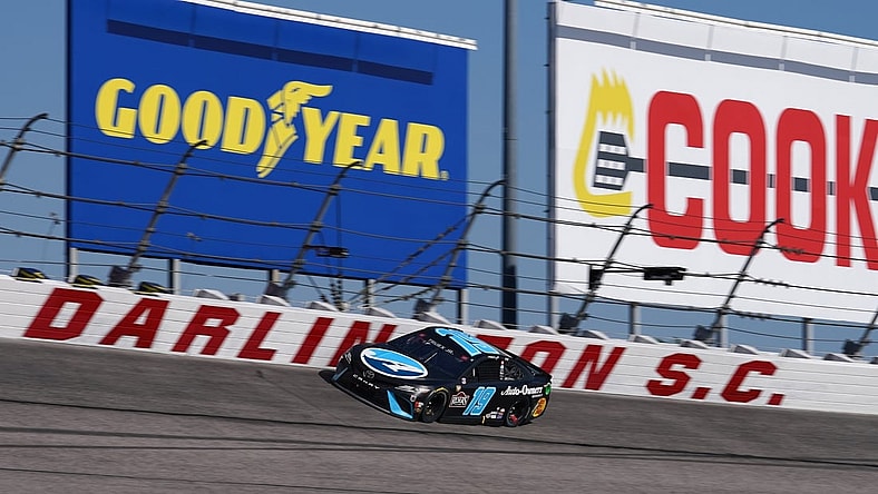 May 9, 2021; Darlington, South Carolina, USA; NASCAR Cup Series driver Martin Truex Jr. (19) races during the Goodyear 400 at Darlington Raceway. Mandatory Credit: Jasen Vinlove-USA TODAY Sports