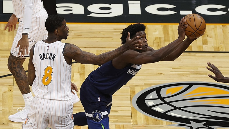 May 9, 2021; Orlando, Florida, USA; Minnesota Timberwolves forward Anthony Edwards (1) passes the ball as Orlando Magic guard Dwayne Bacon (8) defends during the first half at Amway Center. Mandatory Credit: Kim Klement-USA TODAY Sports