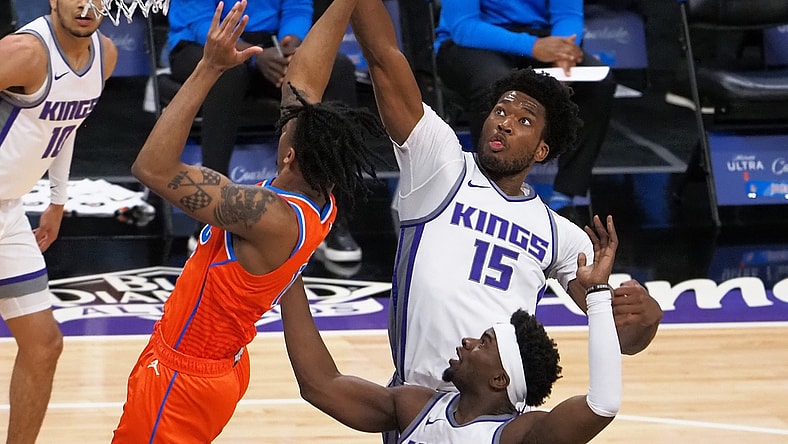 May 9, 2021; Sacramento, California, USA; Sacramento Kings center Damian Jones (15) blocks the shot by Oklahoma City Thunder forward Josh Hall (15) during the first quarter at Golden 1 Center. Mandatory Credit: Kelley L Cox-USA TODAY Sports