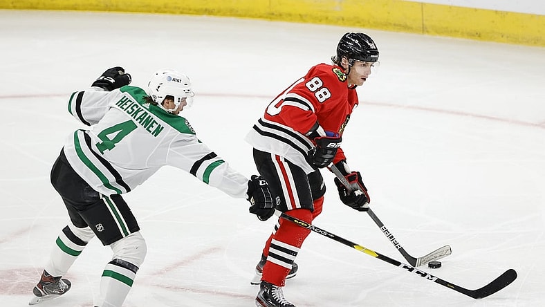 May 10, 2021; Chicago, Illinois, USA; Chicago Blackhawks right wing Patrick Kane (88) looks to pass the puck away from Dallas Stars defenseman Miro Heiskanen (4) during the first period at United Center. Mandatory Credit: Kamil Krzaczynski-USA TODAY Sports