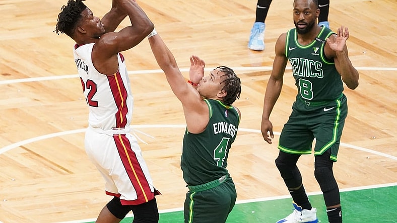 May 11, 2021; Boston, Massachusetts, USA; Miami Heat forward Jimmy Butler (22) scores against Boston Celtics guard Carsen Edwards (4) in the first quarter at TD Garden. Mandatory Credit: David Butler II-USA TODAY Sports