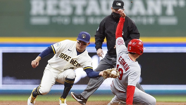 May 11, 2021; Milwaukee, Wisconsin, USA;  St. Louis Cardinals second baseman Tommy Edman (19) steals second base behind Milwaukee Brewers shortstop Luis Ur  as (2) during the third inning at American Family Field. Mandatory Credit: Jeff Hanisch-USA TODAY Sports