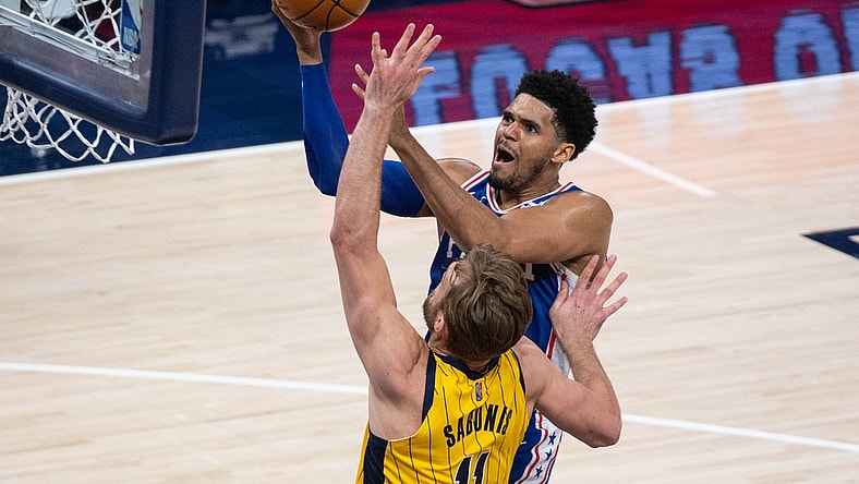 May 11, 2021; Indianapolis, Indiana, USA; Philadelphia 76ers forward Tobias Harris (12) shoots the ball while Indiana Pacers forward Domantas Sabonis (11) defends in the third quarter at Bankers Life Fieldhouse. Mandatory Credit: Trevor Ruszkowski-USA TODAY Sports
