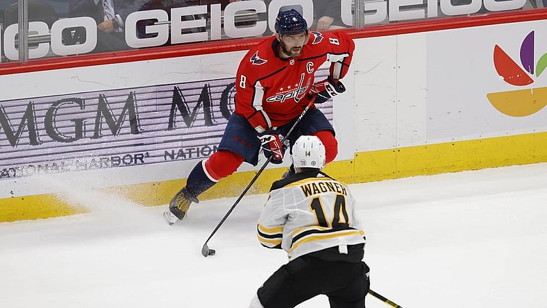 May 11, 2021; Washington, District of Columbia, USA; Washington Capitals left wing Alex Ovechkin (8) skates with the puck as Boston Bruins right wing Chris Wagner (14) defends in the second period at Capital One Arena. Mandatory Credit: Geoff Burke-USA TODAY Sports