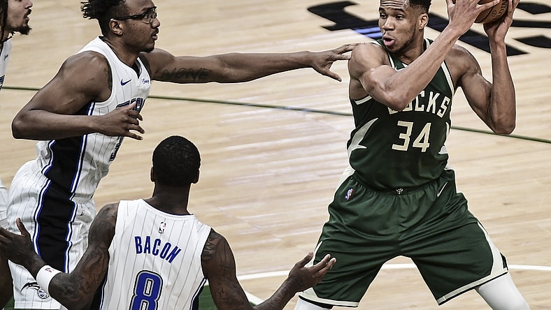 May 11, 2021; Milwaukee, Wisconsin, USA; Milwaukee Bucks forward Giannis Antetokounmpo (34) controls the ball against Orlando Magic center Wendell Carter Jr. (34) during the second quarter at Fiserv Forum. Mandatory Credit: Benny Sieu-USA TODAY Sports