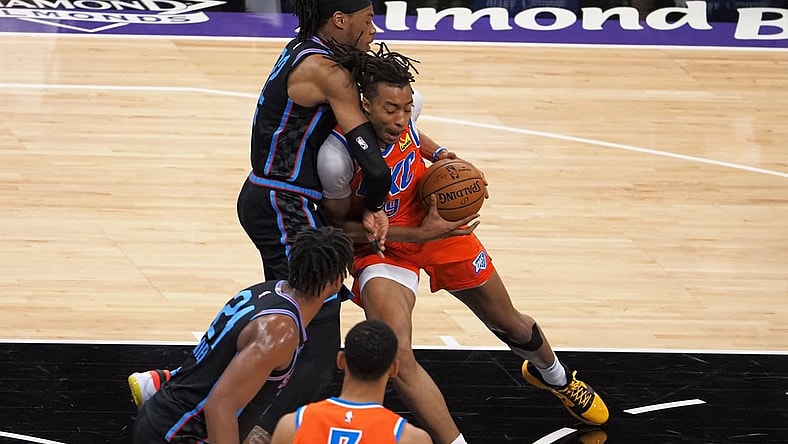 May 11, 2021; Sacramento, California, USA; Oklahoma City Thunder center Moses Brown (9) drives in against Sacramento Kings forward Richaun Holmes (22) during the first quarter at Golden 1 Center. Mandatory Credit: Kelley L Cox-USA TODAY Sports