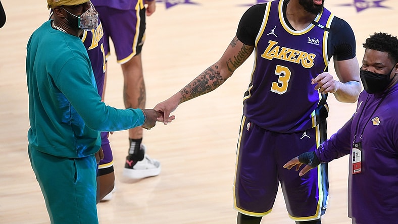 May 11, 2021; Los Angeles, California, USA; Los Angeles Lakers forward LeBron James (L) celebrates with forward Anthony Davis (3) after defeating the New York Knicks in overtime at Staples Center. Mandatory Credit: Jayne Kamin-Oncea-USA TODAY Sports