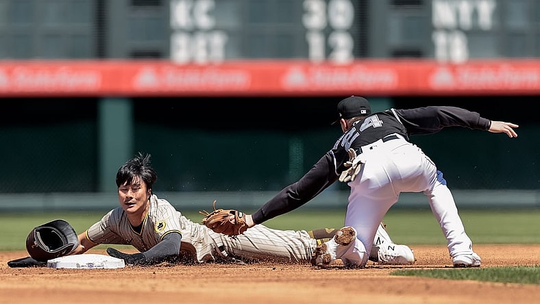 May 12, 2021; Denver, Colorado, USA; San Diego Padres shortstop Ha-Seong Kim (7) safely slides into second ahead of a tag from Colorado Rockies third baseman Ryan McMahon (24) in the second inning at Coors Field. Mandatory Credit: Isaiah J. Downing-USA TODAY Sports