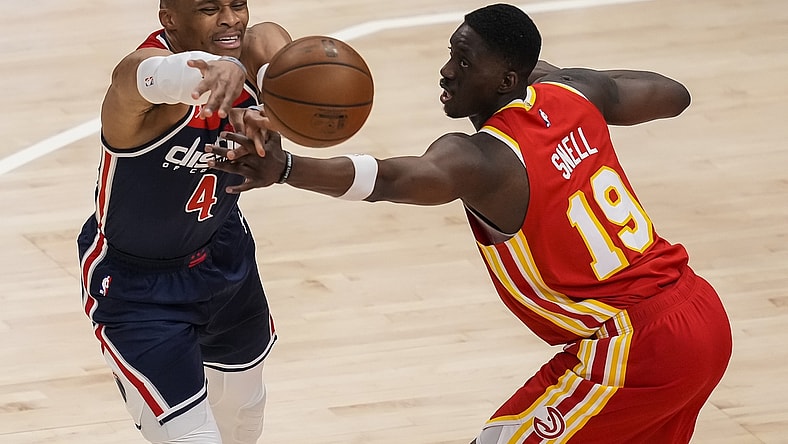 May 12, 2021; Atlanta, Georgia, USA; Washington Wizards guard Russell Westbrook (4) is fouled while passing against Atlanta Hawks forward Tony Snell (19) during the first quarter at State Farm Arena. Mandatory Credit: Dale Zanine-USA TODAY Sports