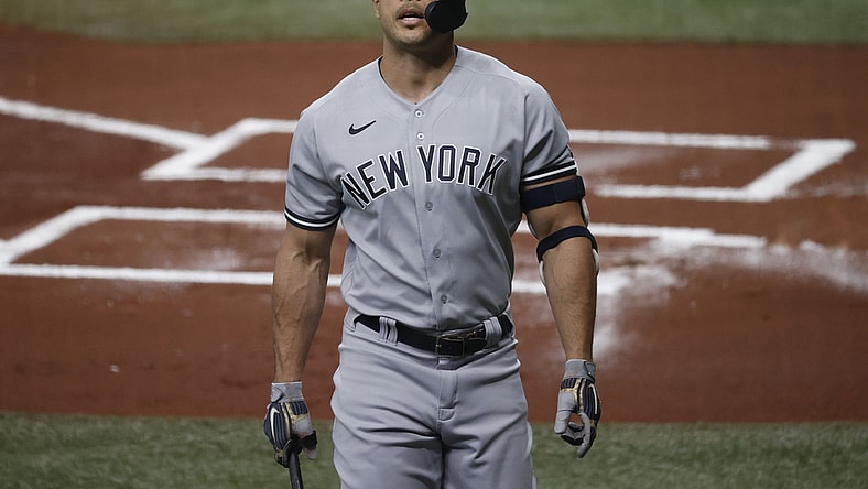 May 12, 2021; St. Petersburg, Florida, USA; New York Yankees designated hitter Giancarlo Stanton (27) strikes out during the first inning against the Tampa Bay Rays at Tropicana Field. Mandatory Credit: Kim Klement-USA TODAY Sports