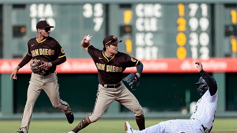 May 12, 2021; Denver, Colorado, USA; San Diego Padres shortstop Ha-Seong Kim (7) attempts to turn a double play as Colorado Rockies first baseman Connor Joe (9) slides out into second as second baseman Tucupita Marcano (16) looks on in the first inning at Coors Field. Mandatory Credit: Isaiah J. Downing-USA TODAY Sports