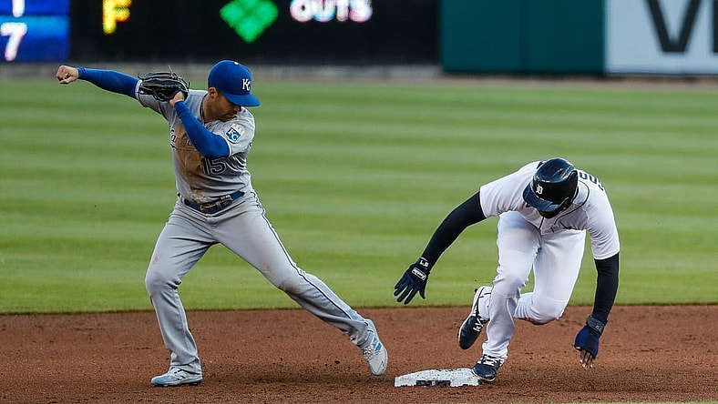 Detroit Tigers short stop Niko Goodrum (28) slides into second base against Kansas City Royals second baseman Whit Merrifield (15) during second inning at Comerica Park in Detroit on Wednesday, May 12, 2021.