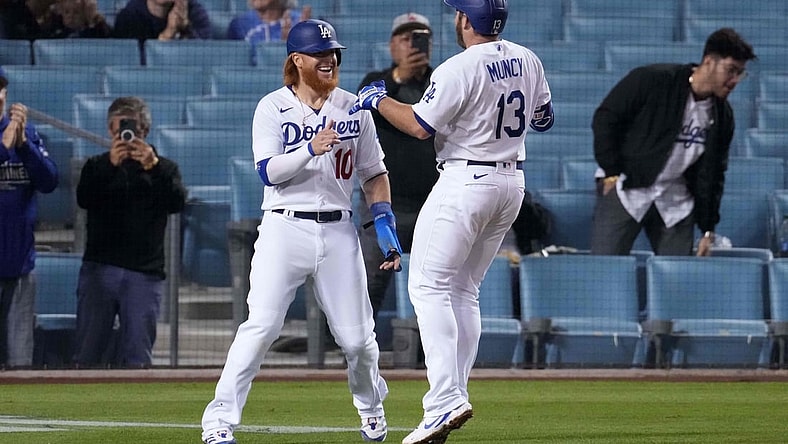 May 12, 2021; Los Angeles, California, USA; Los Angeles Dodgers first baseman Max Muncy (13) celebrates with third baseman Justin Turner (10) after hitting a two-run home run during the fifth inning against the Seattle Mariners at Dodger Stadium. Mandatory Credit: Kirby Lee-USA TODAY Sports