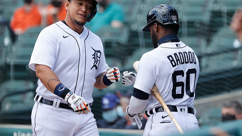 May 13, 2021; Detroit, Michigan, USA;  Detroit Tigers designated hitter Miguel Cabrera (24) receives congratulations from  center fielder Akil Baddoo (60) after scoring in the second inning wk. at Comerica Park. Mandatory Credit: Rick Osentoski-USA TODAY Sports