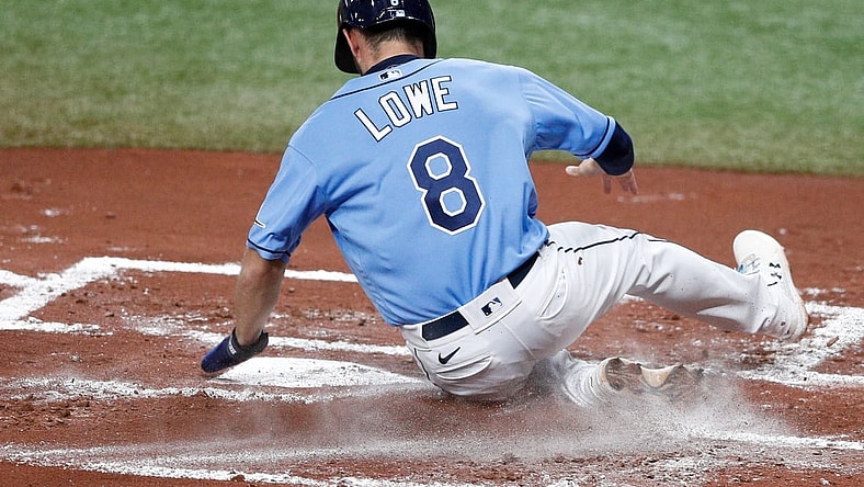 May 13, 2021; St. Petersburg, Florida, USA;  Tampa Bay Rays second baseman Brandon Lowe (8) scores a run in the first inning against the New York Yankees at Tropicana Field. Mandatory Credit: Nathan Ray Seebeck-USA TODAY Sports