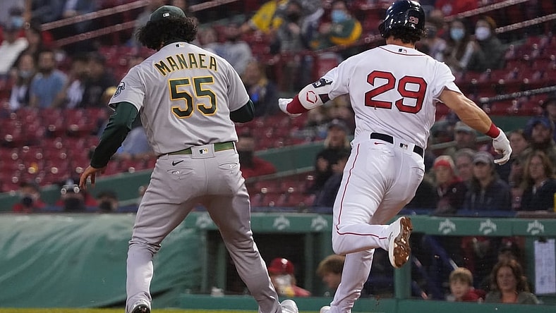 May 13, 2021; Boston, Massachusetts, USA; Boston Red Sox third baseman Bobby Dalbec (29) is called safe at first base against Oakland Athletics starting pitcher Sean Manaea (55) during the third inning at Fenway Park. Mandatory Credit: David Butler II-USA TODAY Sports