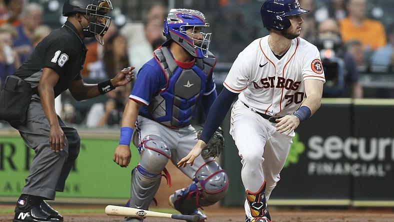 May 13, 2021; Houston, Texas, USA; Houston Astros left fielder Kyle Tucker (30) with a base hit against the Texas Rangers in the second inning at Minute Maid Park. Mandatory Credit: Thomas Shea-USA TODAY Sports