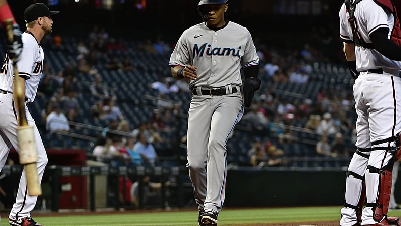 May 13, 2021; Phoenix, Arizona, USA; Miami Marlins center fielder Magneuris Sierra (C) scores a run during the third inning against the Arizona Diamondbacks at Chase Field. Mandatory Credit: Matt Kartozian-USA TODAY Sports