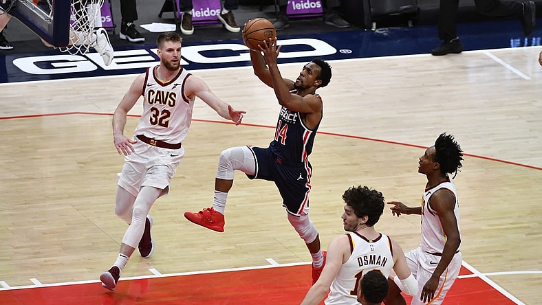 May 14, 2021; Washington, District of Columbia, USA; Washington Wizards guard Ish Smith (14) shoots as Cleveland Cavaliers forward Dean Wade (32) looks on during the second quarter at Capital One Arena. Mandatory Credit: Brad Mills-USA TODAY Sports