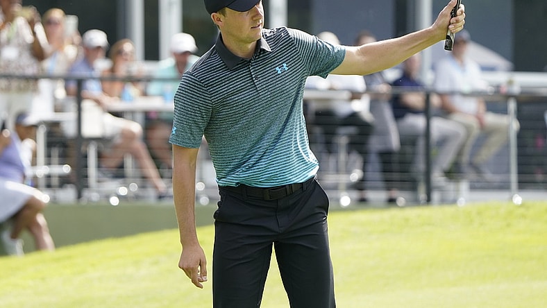 May 15, 2021; McKinney, Texas, USA; Jordan Spieth reacts on his eagle shot on the 18th green during the third round of the Byron Nelson golf tournament. Mandatory Credit: Jim Cowsert-USA TODAY Sports