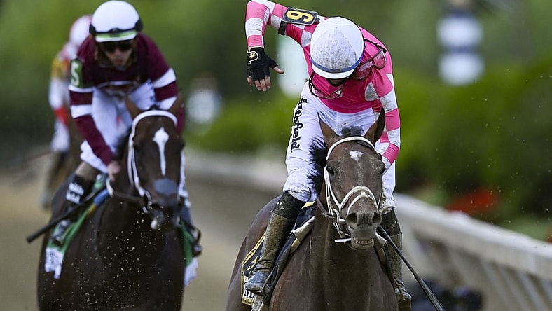 May 15, 2021; Baltimore, Maryland, USA; Flavien Prat aboard  Rombauer reacts after winning the  146th running of the Preakness Stakes at Pimlico Race Course. Mandatory Credit: Tommy Gilligan-USA TODAY Sports