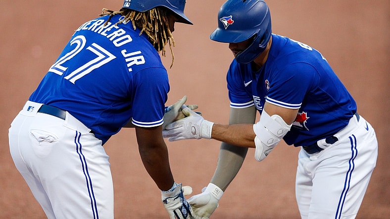 May 15, 2021; Dunedin, Florida, CAN;  Toronto Blue Jays center fielder Randal Grichuk (15) congratulates first baseman Vladimir Guerrero Jr. (27) after hitting a home run in the first inning against the Philadelphia Phillies at TD Ballpark. Mandatory Credit: Nathan Ray Seebeck-USA TODAY Sports