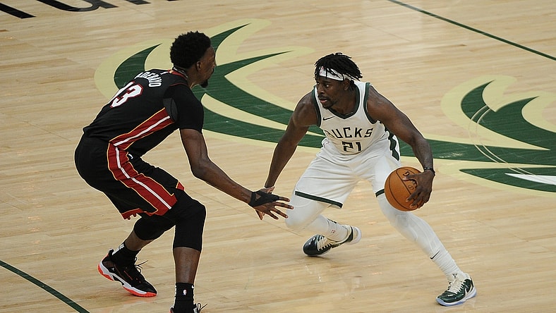 May 15, 2021; Milwaukee, Wisconsin, USA;  Miami Heat center Bam Adebayo (13) guards Milwaukee Bucks guard Jrue Holiday (21) in the third quarter at Fiserv Forum. Mandatory Credit: Michael McLoone-USA TODAY Sports