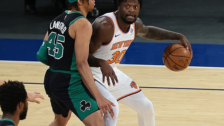 May 16, 2021; New York, New York, USA; New York Knicks forward Julius Randle (30) dribbles as Boston Celtics guard Romeo Langford (45) defends during the first quarter at Madison Square Garden. Mandatory Credit: Vincent Carchietta-USA TODAY Sports