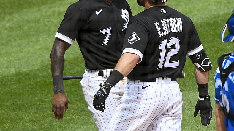 May 16, 2021; Chicago, Illinois, USA;  Chicago White Sox right fielder Adam Eaton (12) celebrates with Chicago White Sox shortstop Tim Anderson (7) after they score on Eaton's two rune home run against the Kansas City Royals during the fifth inning at Guaranteed Rate Field. Mandatory Credit: Matt Marton-USA TODAY Sports