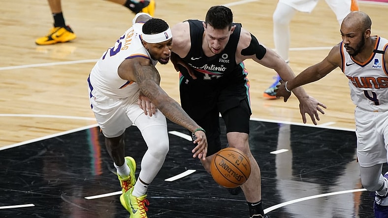 May 16, 2021; San Antonio, Texas, USA; Phoenix Suns forward Torrey Craig (12) and San Antonio Spurs forward Drew Eubanks (14) go after loose ball in the fourth quarter at AT&T Center. Mandatory Credit: Scott Wachter-USA TODAY Sports